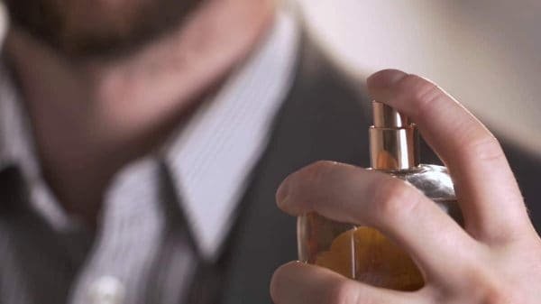 Man Holding Perfume Bottle