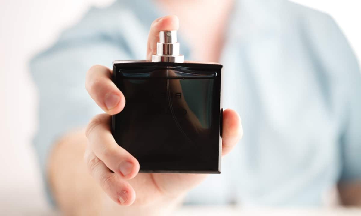 Man Holding Cologne